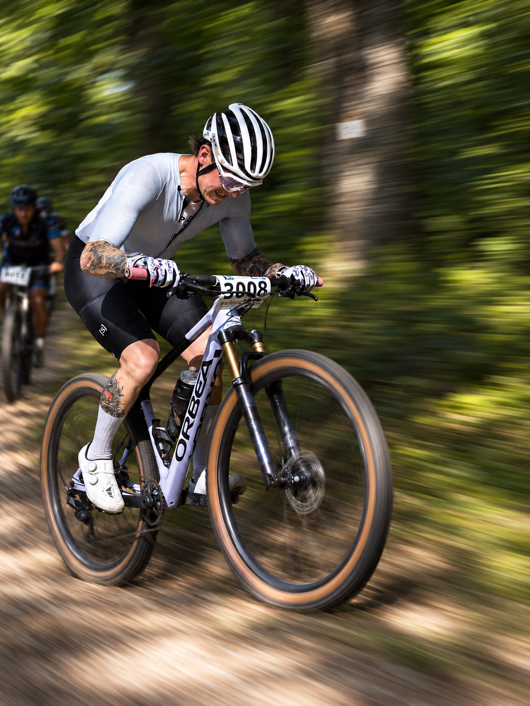 Cyclist preparing bottles and ride nutrition before a gravel ride